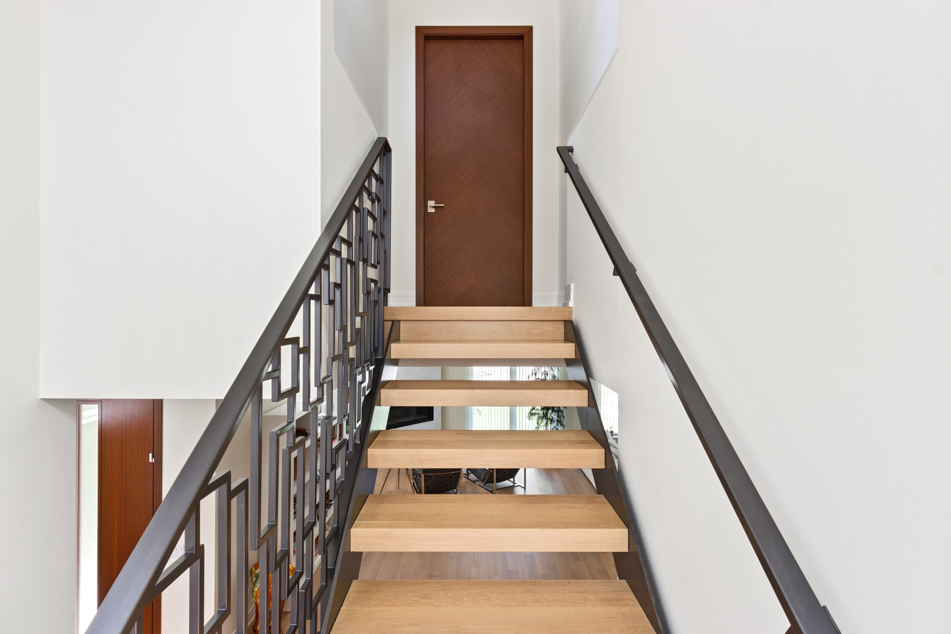 Front View of Stairs leading to modern Interior Door  - Glenview Haus - Custom Doors, Wine Cellars and Cabinets in Chicago