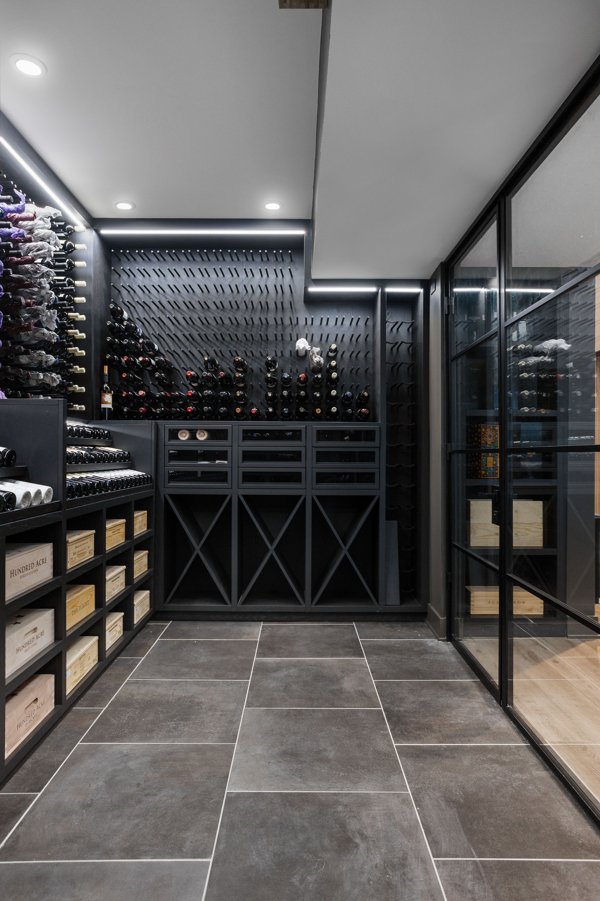 Modern Wine Cellar Steel and Glass Side Wall Display  - Glenview Haus - Custom Doors, Wine Cellars and Cabinets in Chicago
