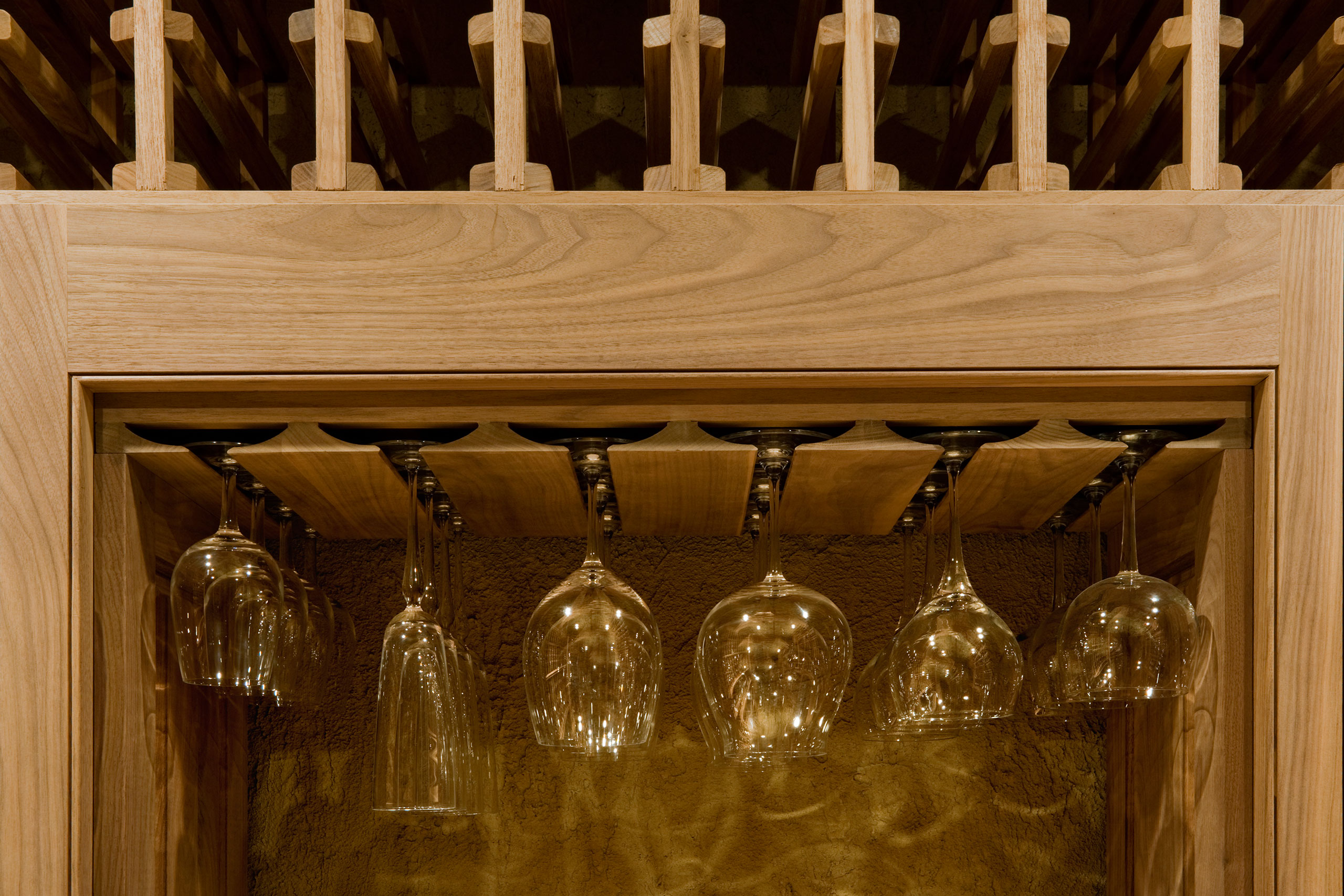 Functional and elegant custom glassware display in wine cellar.  - Glenview Haus - Custom Doors, Wine Cellars and Cabinets in Chicago
